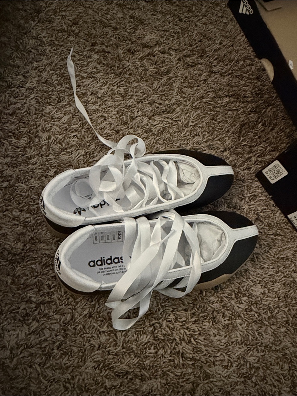 adidas woman’s Black and White Low-Top Sneakers